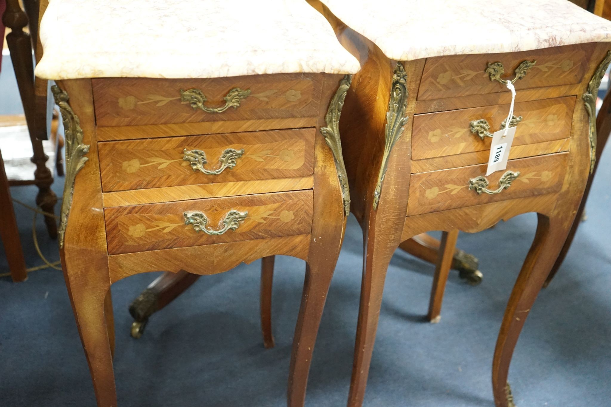 A pair of Louis XVI design marquetry inlaid, gilt metal mounted serpentine bedside chests, width 34cm, depth 29cm, height 73cm